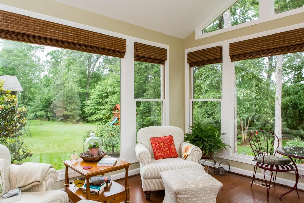 Bright and airy sunroom with a ceiling fan and natural light in Essex by Craft Design + Build