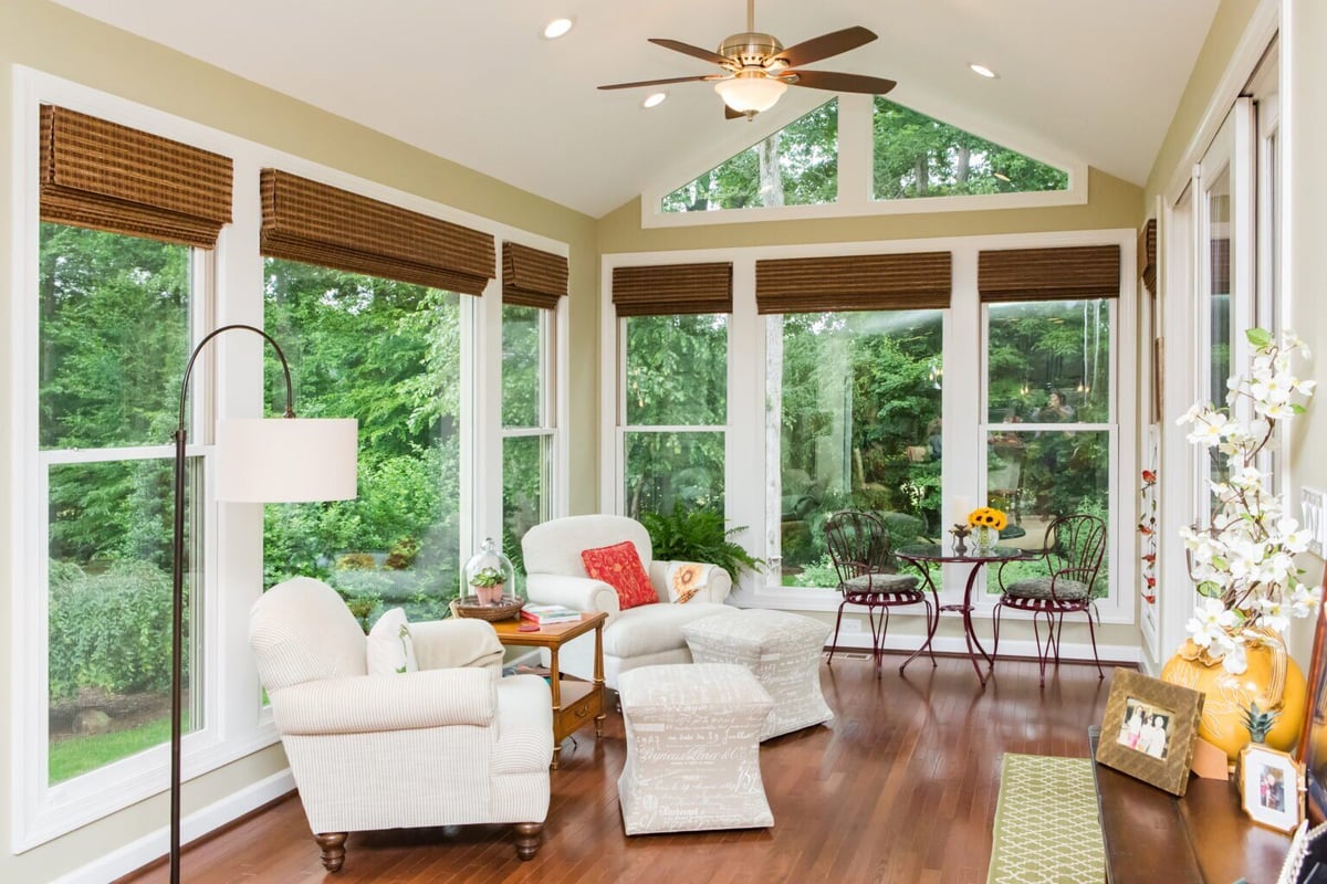 Custom sunroom with large windows and a view of the backyard in Essex by Craft Design + Build