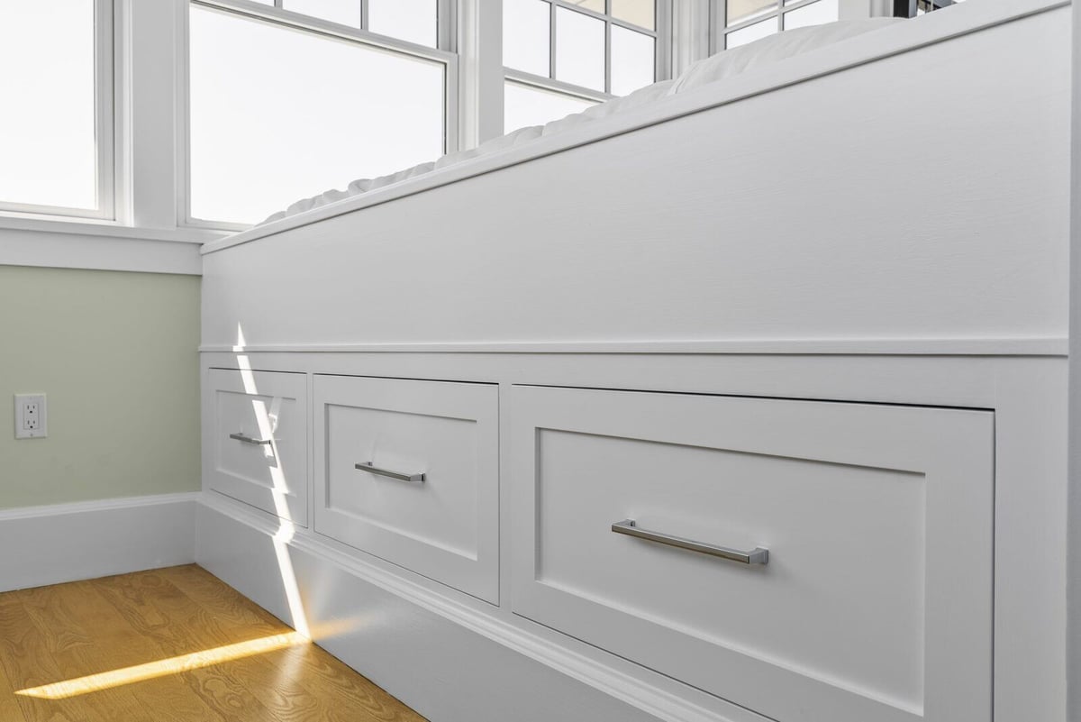 Detailed view of storage drawers in a custom-built bed in Essex, Connecticut by Craft Design + Build