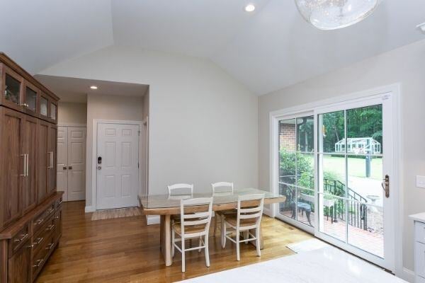 Dining area with glass doors leading to patio in a South Raleigh home remodel by Craft Design + Build