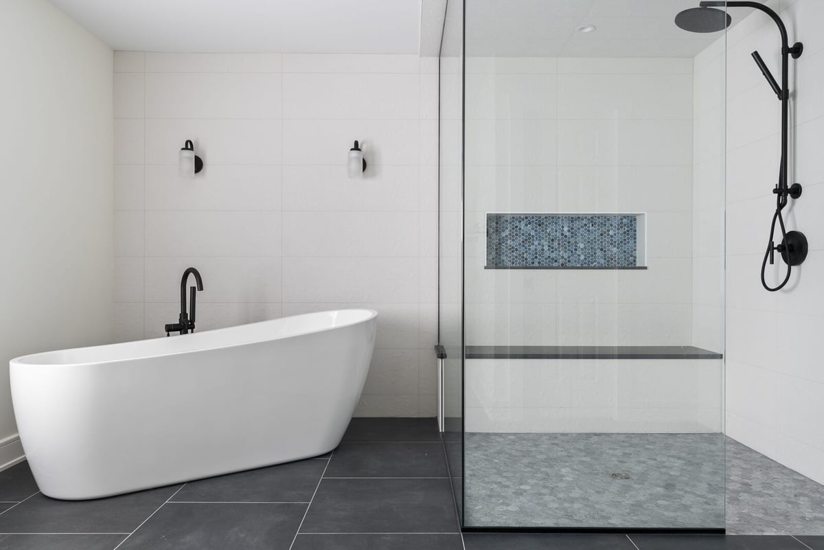 Elegant bathroom remodel featuring a soaking tub and glass shower by Craft Design + Build, Killingworth, CT