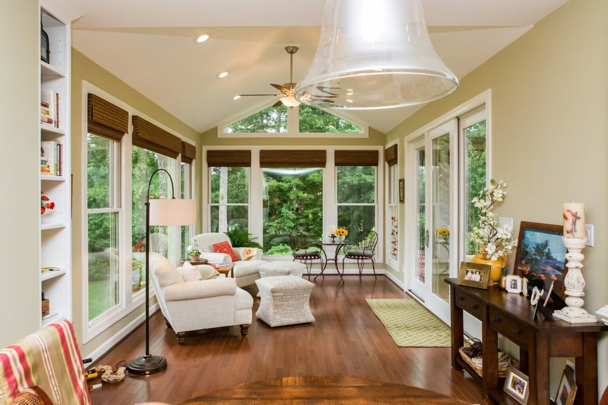 Elegant sunroom with a mix of natural light and garden views in Essex, Connecticut by Craft Design + Build