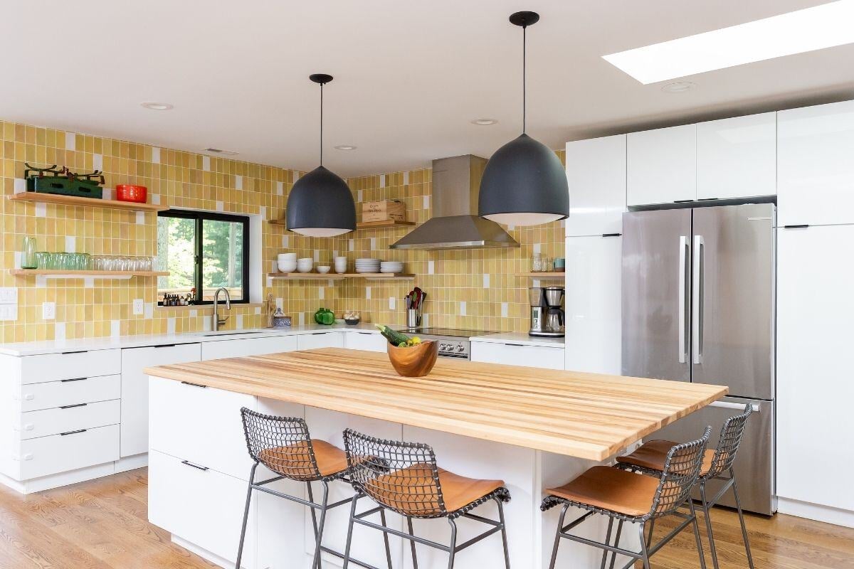 Essex Connecticut kitchen renovation with vibrant tile and spacious island by Craft Design + Build