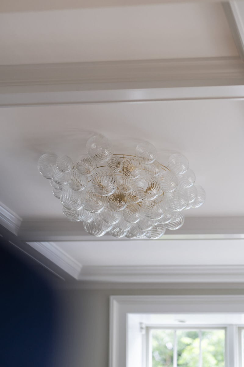 Elegant ceiling light fixture in a remodeled home by Craft Design and Build in Essex, Connecticut