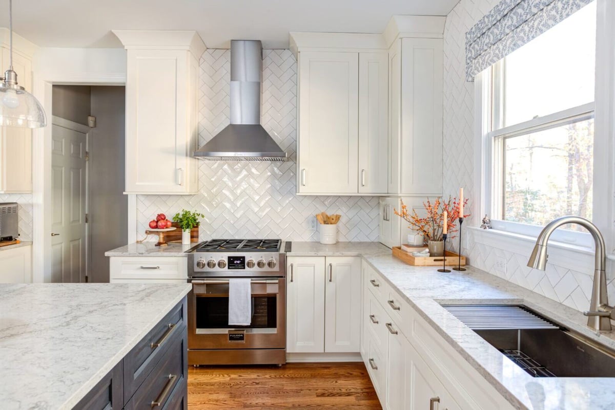 Full view of remodeled Essex, Connecticut kitchen with white cabinets by Craft Design + Build