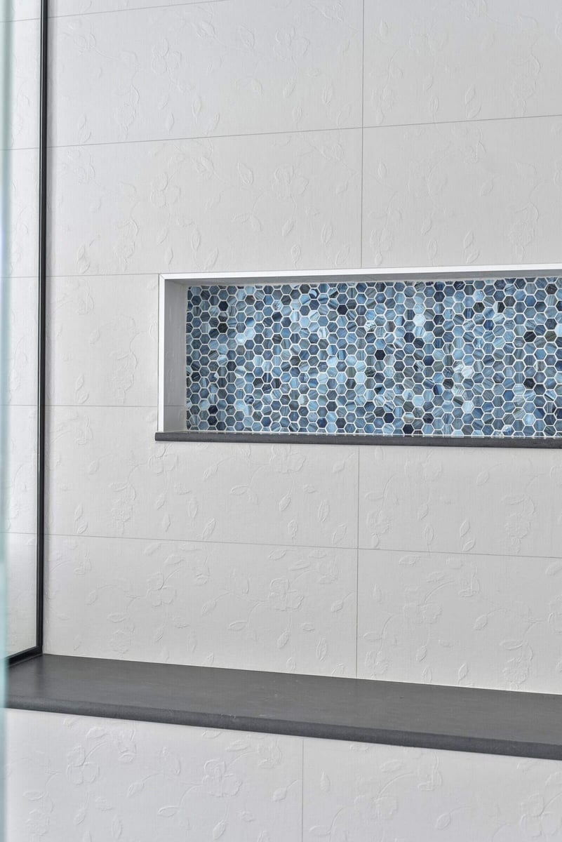 Hexagonal grey tile flooring in a modern Killingworth bathroom, part of a renovation by Craft Design + Build, Essex, Connecticut