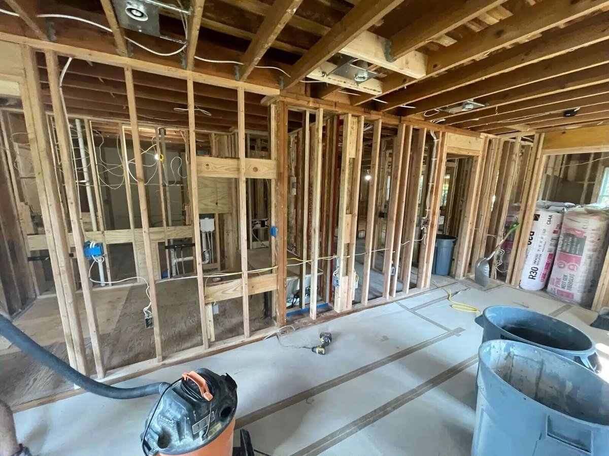 In-progress home renovation with exposed framing and wiring in Essex by Craft Design + Build, Essex Connecticut