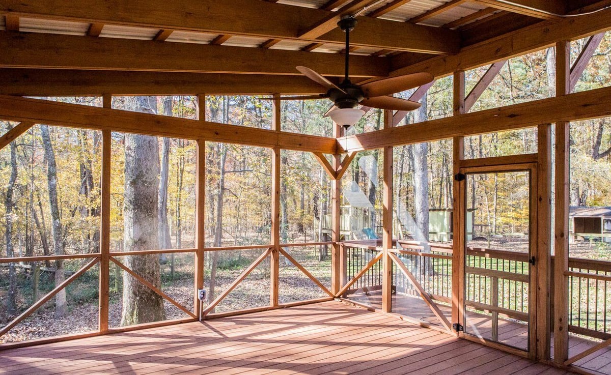 Indoor-outdoor screened porch with wood framing and fan, constructed by Craft Design + Build in Essex, Connecticut