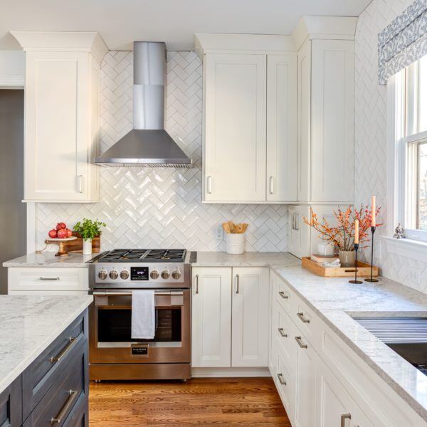 Kitchens, Essex, Connecticut custom remodel by CRAFT design+build, featuring white cabinetry and stainless steel appliances