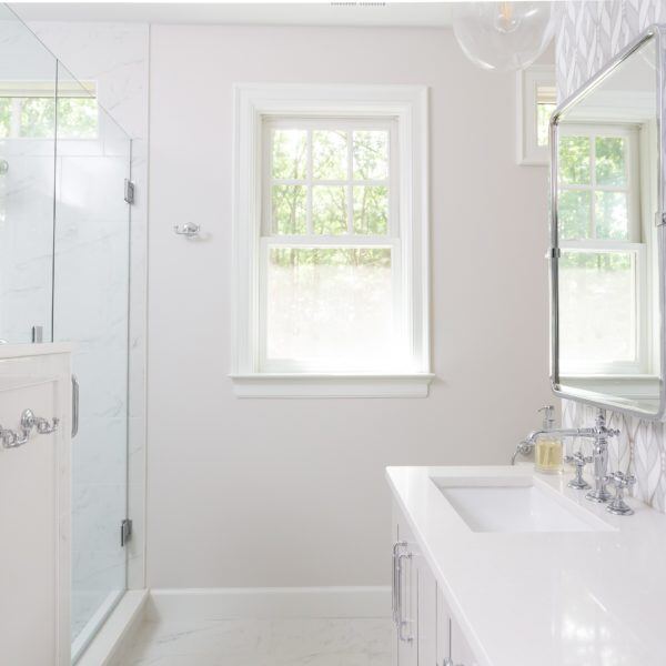 Luxury bathroom with marble surfaces in a custom Essex, Connecticut remodel