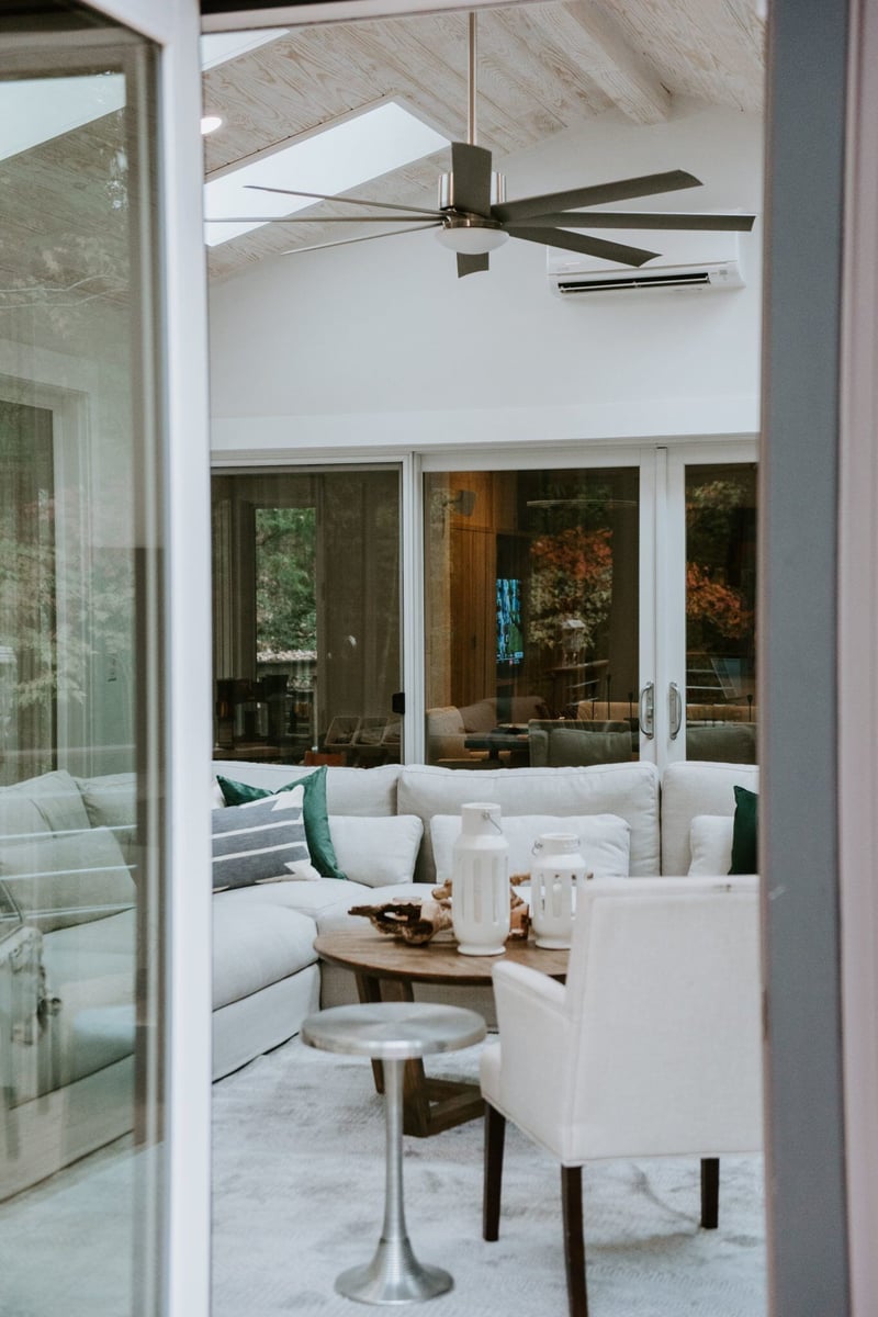 Modern 4 seasons room with floor-to-ceiling windows and a cozy seating arrangement in Essex, Connecticut