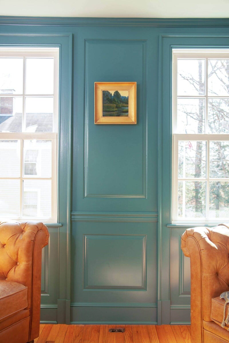 Simple and elegant teal wall with framed artwork in a custom home remodel in Chester, Connecticut