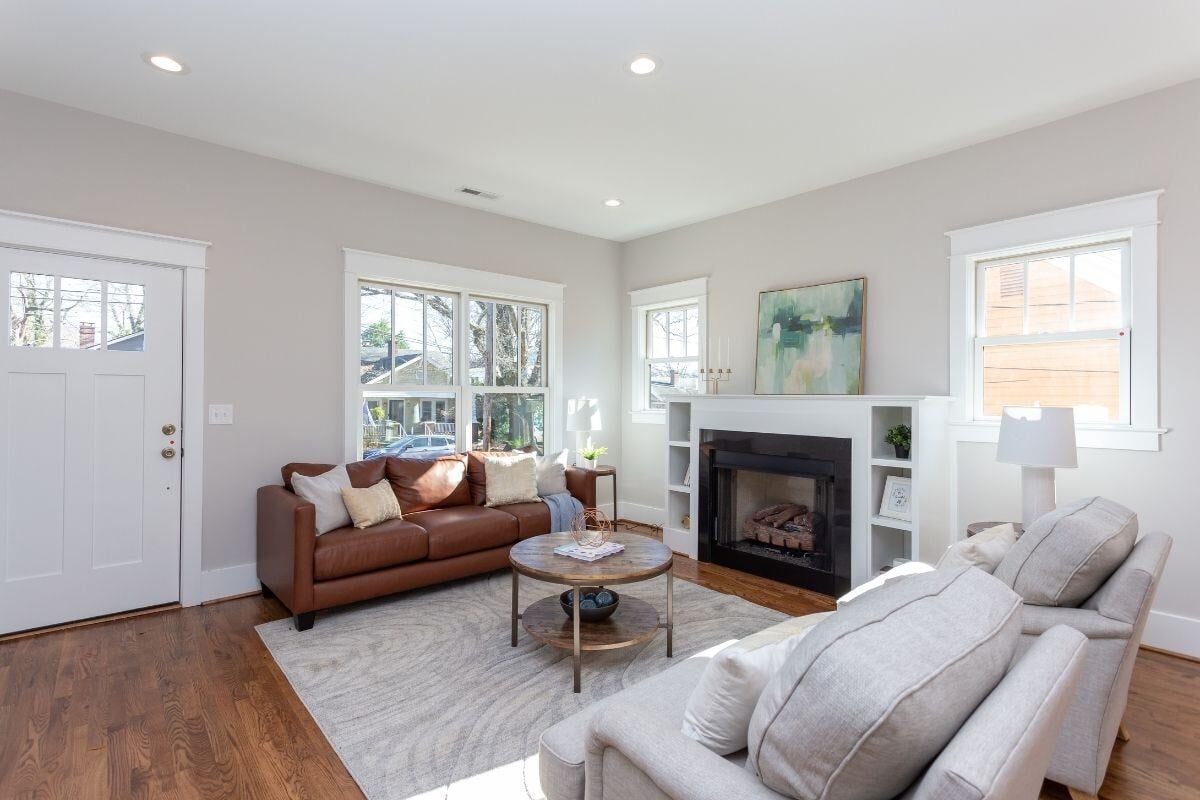 Spacious living room featuring updated decor in a custom home renovation by Craft Design + Build, Essex, Connecticut